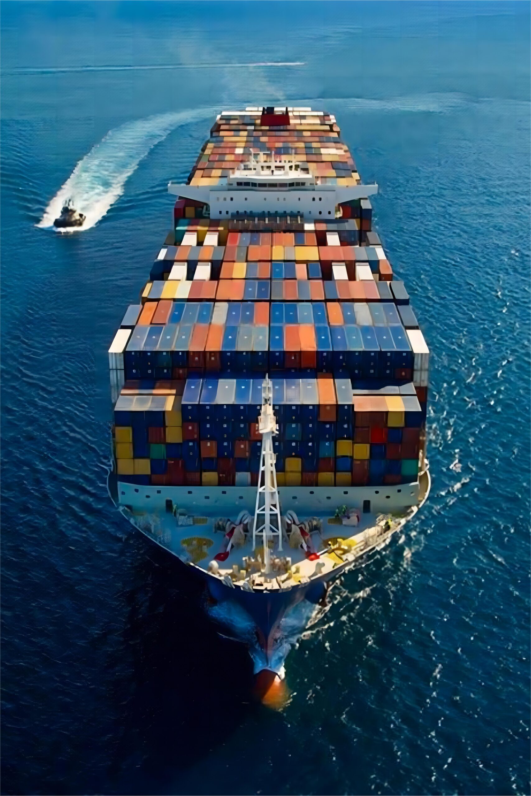 Industrial machinery being loaded onto a container ship