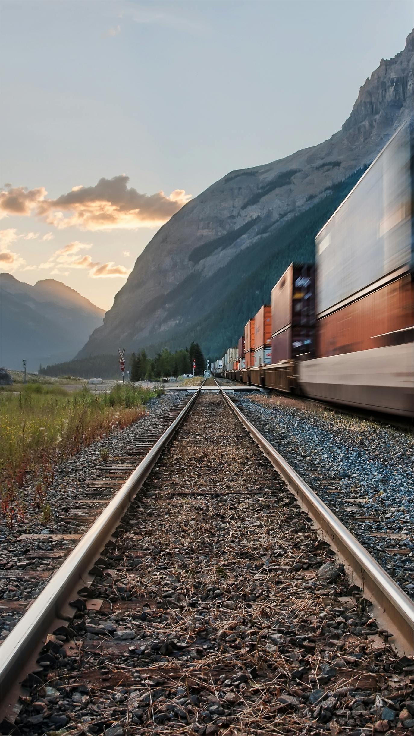Cargo planes being loaded at an airport with containers
