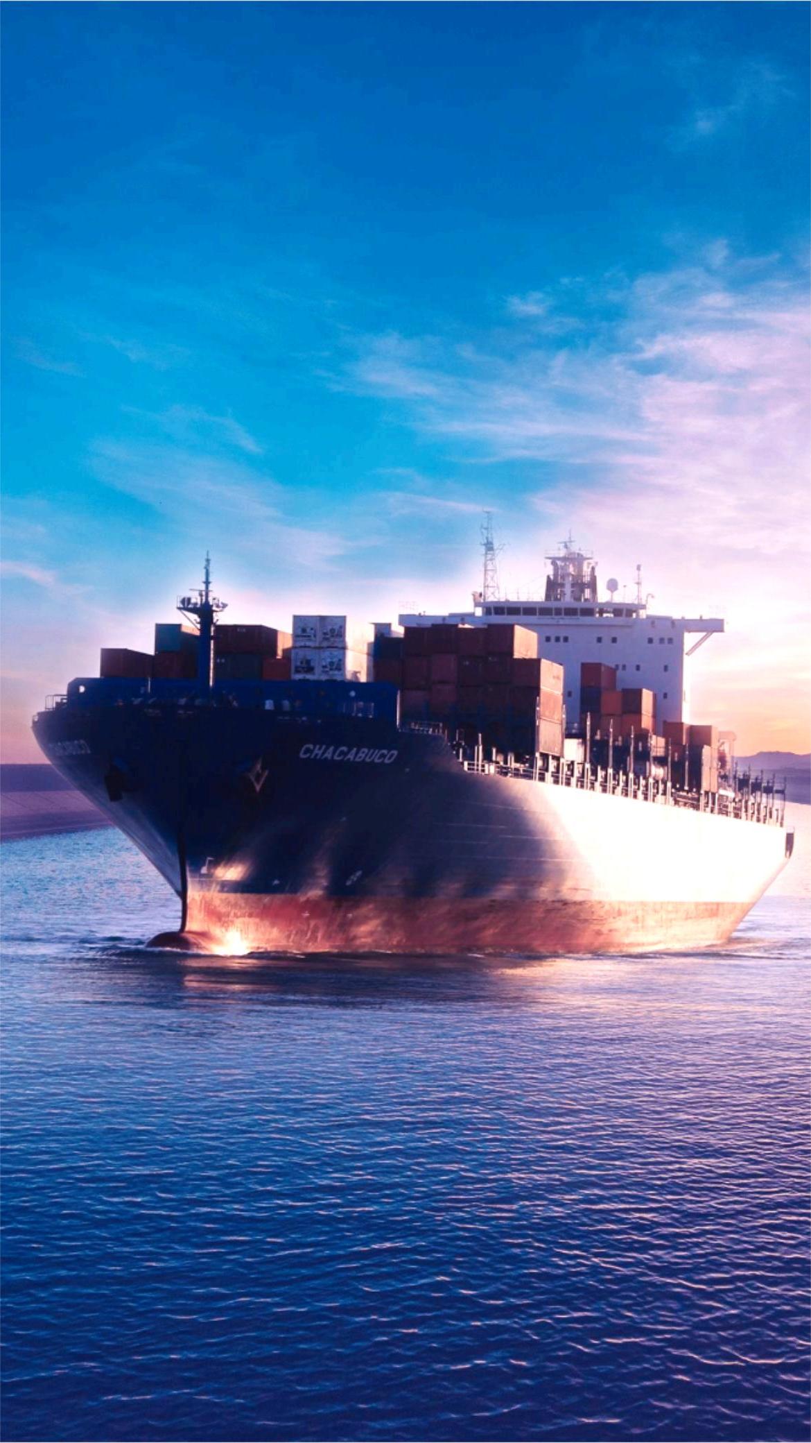 Cargo ships at a busy port, representing international LCL shipping