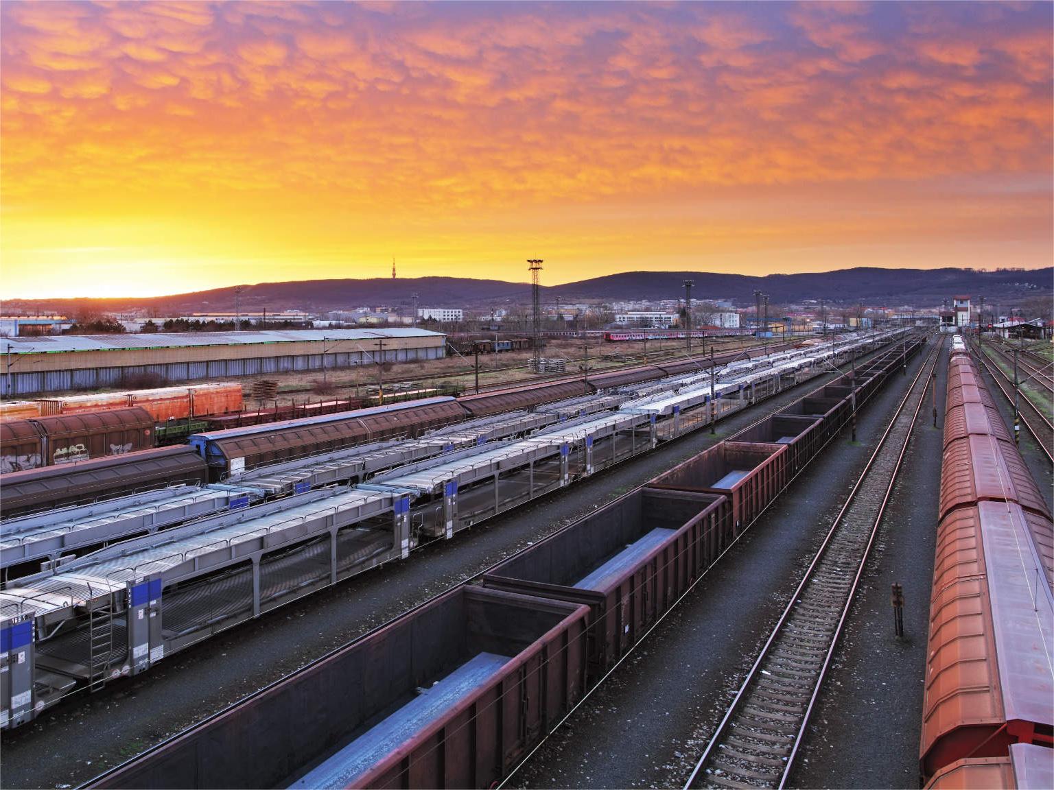 Heavy duty logistics trucks traveling on a highway through Central Asia toward the Middle East