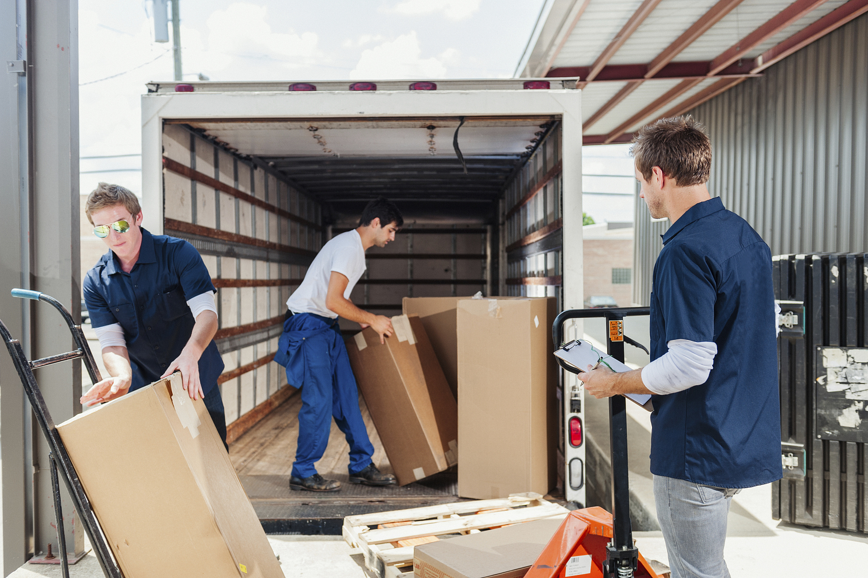Logistics worker scanning a package for express delivery to Europe