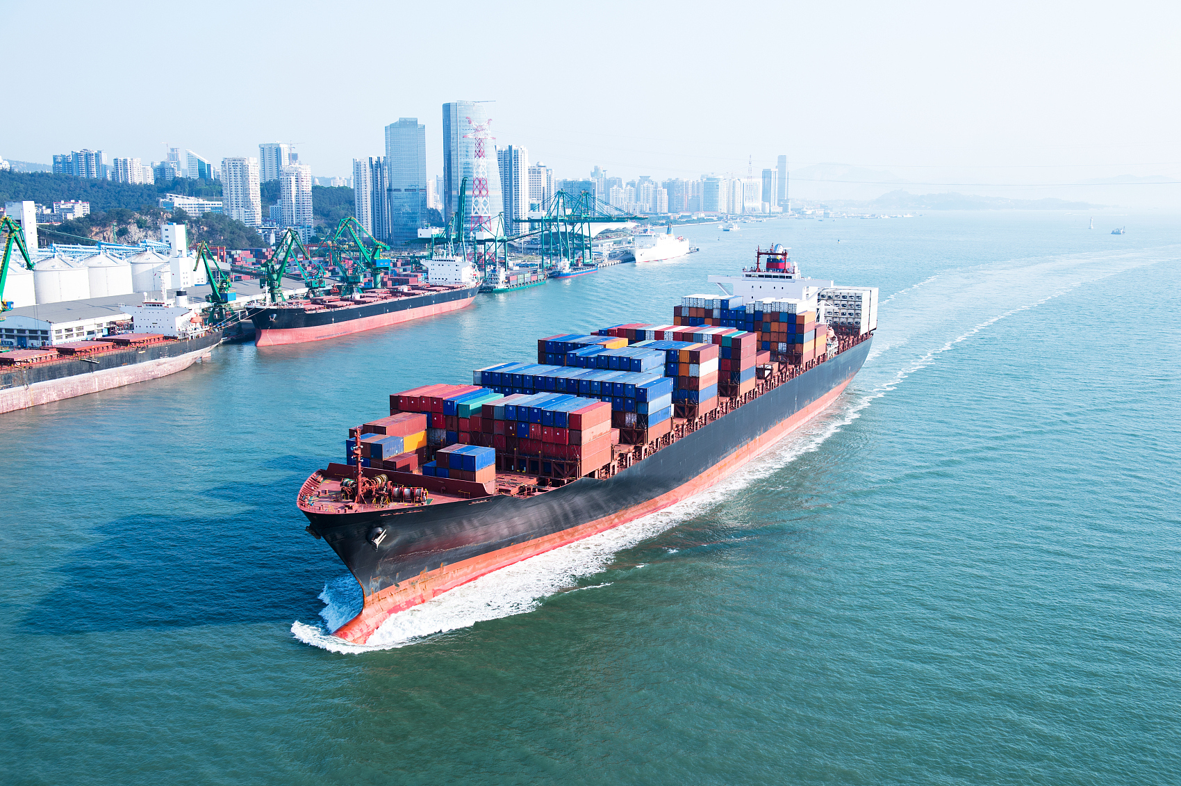 Full container load cargo being loaded at a Chinese port for Spain